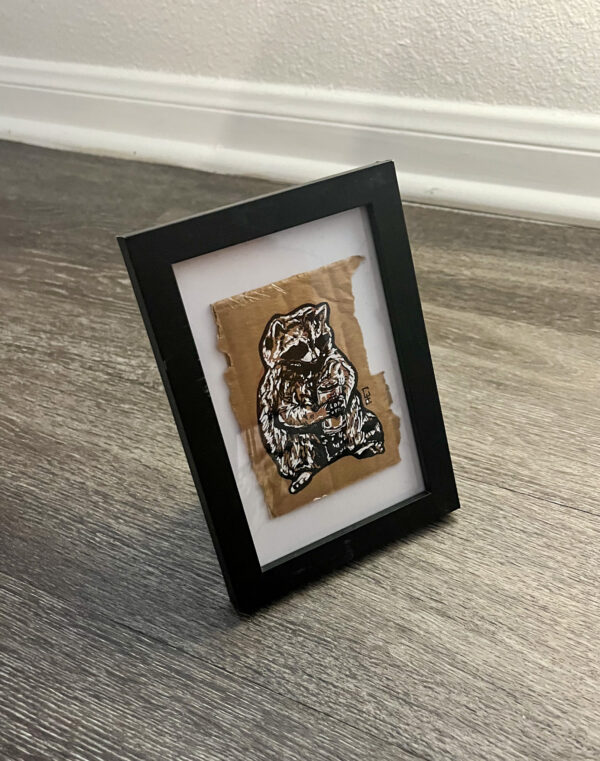 Trash Panda illustration shown framed at a 3/4 angle.