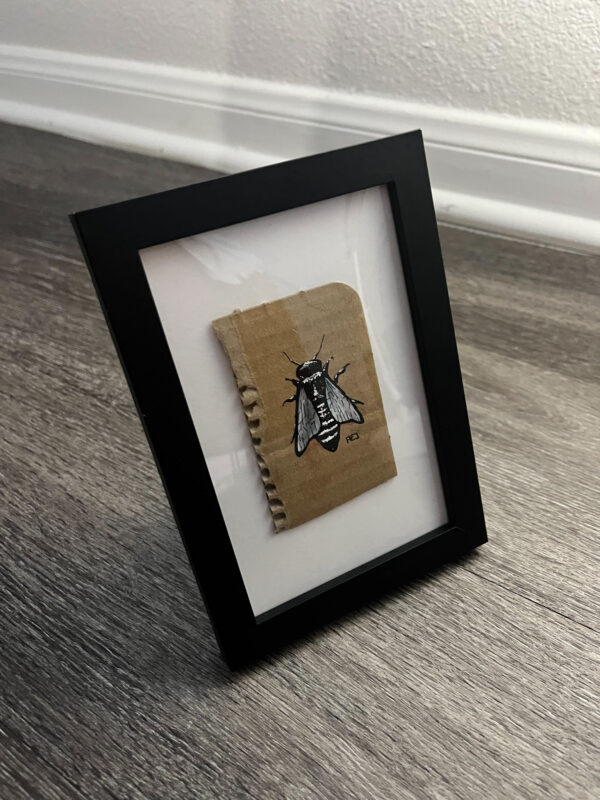 Framed bee piece at a 3/4 view.